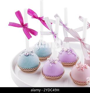 Wedding cake pops on plate isolated Stock Photo