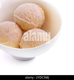 Three balls of vanilla-banana ice cream in white bowl Stock Photo