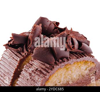 Chocolate roll with cream on a white plate Stock Photo
