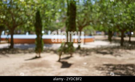 Outdoor defocused image showing a park background with bokeh effect ...