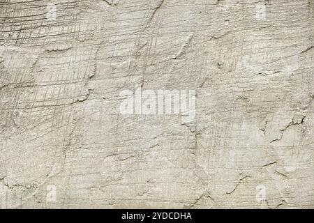 Cement plaster wall background, Cement plaster wall fragment with scratches and cracks, Rough cement plastering wall background, Concrete clean texture free space Stock Photo