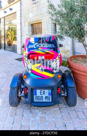 Renault Twizy  two-seat electric microcar displaying BMGoodies advertising - Tours, Indre-et-Loire (37), France. Stock Photo