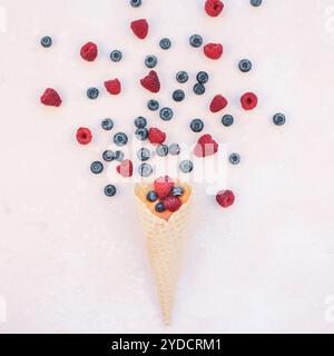 Summer composition berries ice cream waffle cone Stock Photo