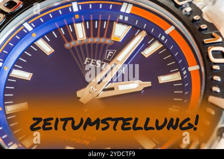 Symbol image time change, winter time: Close-up of a wristwatch with the inset lettering ZEITUMSTELLUNG (time change) Stock Photo