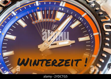 Symbol image time change, winter time: Close-up of a wristwatch with the inset lettering WINTERZEIT (Winter Time) Stock Photo