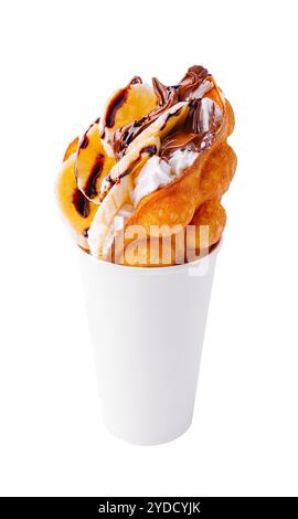 Hong kong or bubble waffle with whipped cream, chocolate and bananas Stock Photo