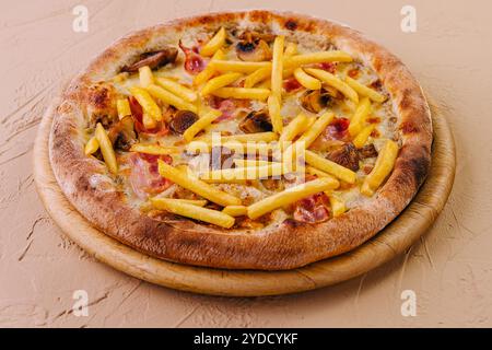 Pizza with bacon, cheese and french fries Stock Photo