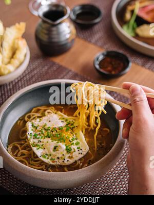 Kimchi noodle spicy soup with egg Stock Photo