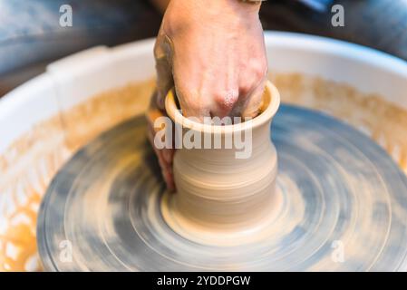 Pottering - creating a clay cup in process Stock Photo