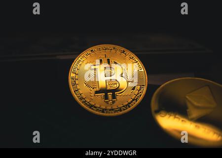 Golden Bitcoin Coin on Dark Background. Stock Photo