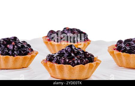 Small cakes with currant on white big plate Stock Photo