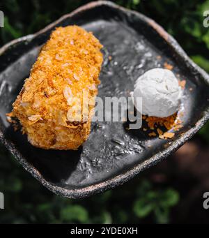 Puff pastry log cake with a scoop of ice cream Stock Photo