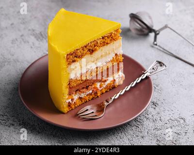 Tasty mango mousse cake on plate Stock Photo