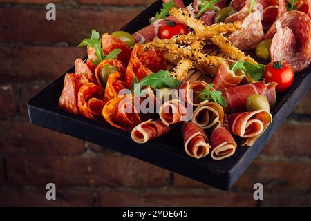 Traditional spanish jamon, prosciutto crudo, italian salami, parma ham Stock Photo