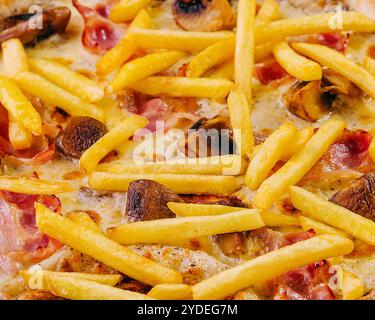 Pizza with bacon, cheese and french fries Stock Photo