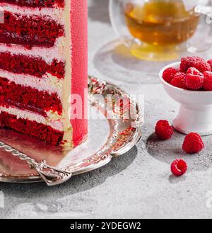 Piece of delicious red velvet cake with tasty cream Stock Photo