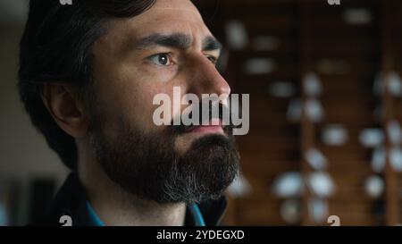Close up thoughtful sad depressed Caucasian mature businessman man male guy worker employee looking distance upset expression thinking business loss Stock Photo