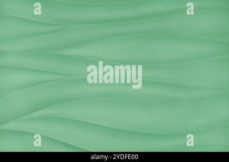 Plaster wall with volumetric relief surface wavy form pattern, green gypsum texture panel. Interior decoration, design element. Wallpaper,background, Stock Photo