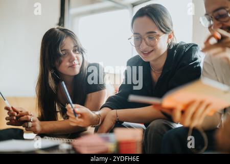Students collaborating on a school project at study group Stock Photo