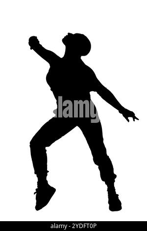 A beautiful silhouette of a woman leaping joyfully into the air with her arms gracefully outstretched, creating a moment of happiness Stock Photo