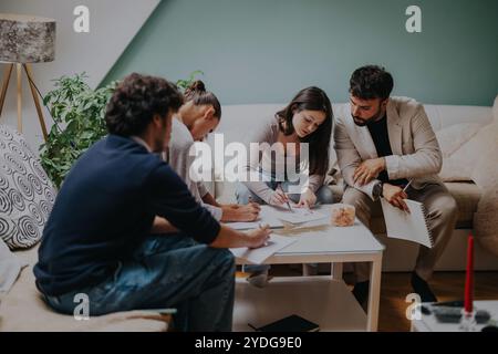 High school students collaborating with professor on assignments at home Stock Photo