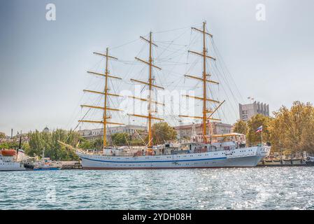 SEVASTOPOL, CRIMEA - AUGUST 24, 2016: Soviet and Russian Black Sea Fleet warships, standing in the quay of the Sevastopol bay, Crimea Stock Photo