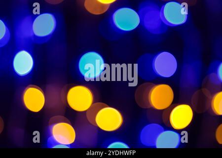 Vibrant Blue Yellow Bokeh Lights Creating Abstract Festive Background with Defocused Circular Patterns Stock Photo