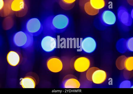 Vibrant Blue Yellow Bokeh Lights Creating Abstract Festive Background with Defocused Circular Patterns Stock Photo