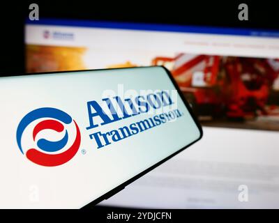 In this photo illustration, a mobile phone with the logo of American company Allison Transmission Holdings Inc. is seen in front of business website. Stock Photo