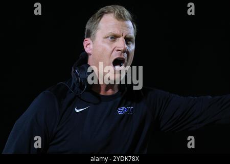 SMU head coach Rhett Lashlee, left, makes a point with an official ...
