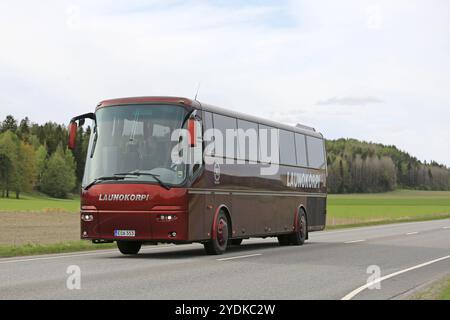 SALO, FINLAND, MAY 25, 2017: Red VDL Bova luxury coach bus of Launokorpi transports passengers along road at spring Stock Photo