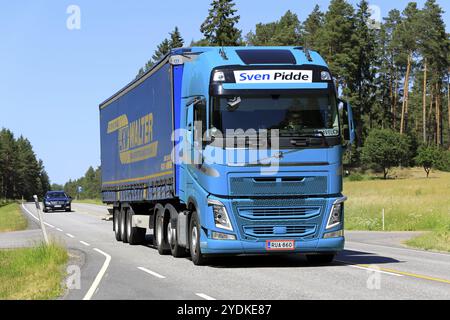 Turquoise Volvo FH truck of Sven Pidde Logistics Oy pulls LKW Walter trailer along Highway 52 on a day of summer. Salo, Finland. June 26, 2020 Stock Photo