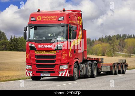 Beautiful red Scania 580S truck semi trailer Transport Logistica for exceptional load transport on highway 52. Salo, Finland. May 12, 2022 Stock Photo