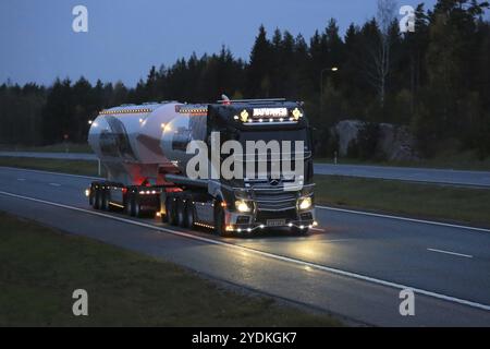 SALO, FINLAND, OCTOBER 21, 2016: Light in darkness. Mercedes-Benz Actros Uniq Concept, the latest super bulk transport truck of Kuljetus Auvinen, truc Stock Photo