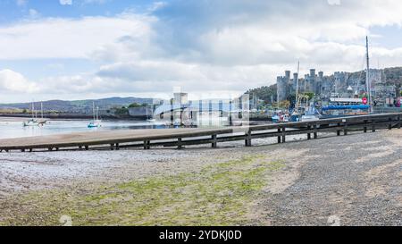 A multi image HDR panorama of Conwy harbour, Wales seen on 26 Ocotober 2024 under a bright blue sky at low tide. Stock Photo