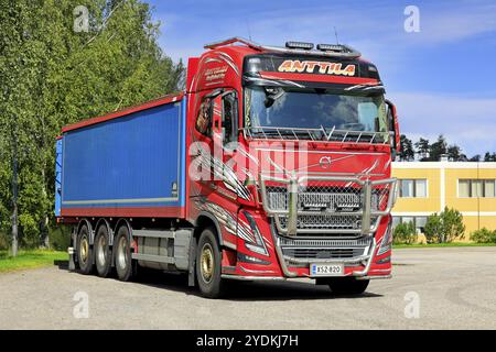 New beautifully customised Volvo FH16 grain truck with hopper trailer parked on the asphalt yard of Pernio granary. Salo, Finland. August 29, 2021 Stock Photo