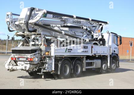 TURKU, FINLAND, MARCH 18, 2017: White Mercedes-Benz Arocs 3542 Schwing Stetter S43SXIII concrete pump truck on the move. The mobile concrete pump has Stock Photo