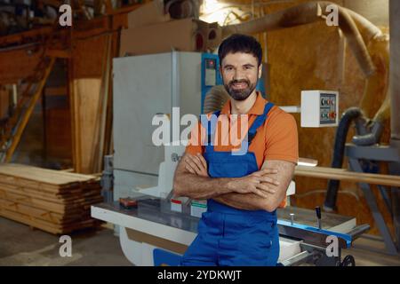 Portrait of woodworker at planer machine at workshop Stock Photo