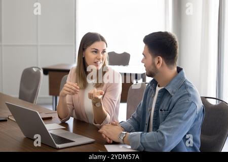 Two company employees working on project at laptop Stock Photo