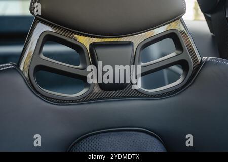 Racing-inspired car seat back featuring carbon fiber accents and ergonomic cut-outs. Stock Photo