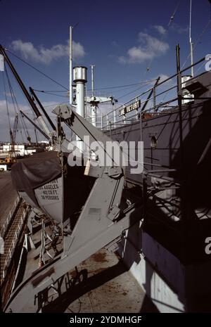 San Pedro, CA. USA. 1983. Lane Victory was built in Los Angeles by the California Shipbuilding Corporation and launched on May 31, 1945. On her first voyage, June 27, 1945, Lane Victory carried war supplies in the Pacific. The War Shipping Administration gave the operations of the ship to the American President Lines. United States Merchant Mariners operated the ship. The United States Navy Armed Guard, who manned the ship's guns, worked as signalmen and radiomen. She made two Pacific cruises, beginning July 10, 1945, to Manus Island, and the second starting August 30, 1945, to Guam, Saipan Stock Photo