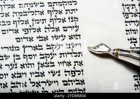 Closeup of the first verse of the weekly reading of Vayeshev in the book of Genesis in the Hebrew Bible, Torah, or Old Testament. Stock Photo