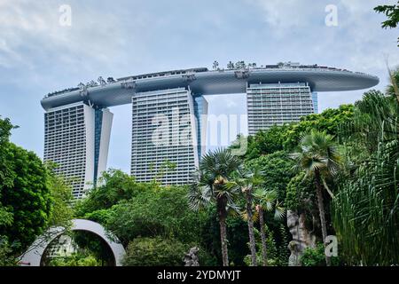 Singapore - August 14, 2024: The famous Marina Bay Sands Hotel. Amazing bottom view of modern towers and the SkyPark bridge on the top of skyscrapers Stock Photo