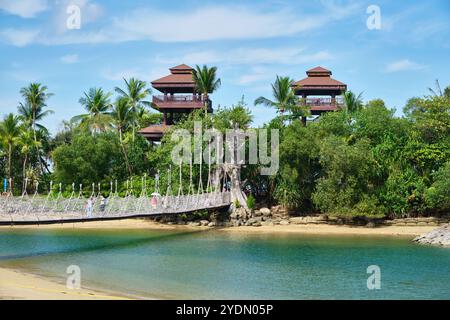 Singapore - August 14, 2024: Golden sand and lush vegetation on the tropical Palawan Beach on Sentosa island Stock Photo
