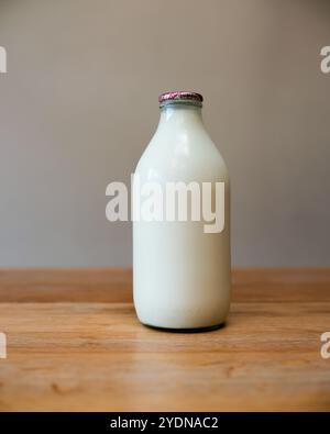 Empty glass bottles for recycling and reuse - milk bottles from United Kingdom in a crate ready for collection by a milk man Stock Photo