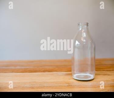 Empty glass bottles for recycling and reuse - milk bottles from United Kingdom in a crate ready for collection by a milk man Stock Photo