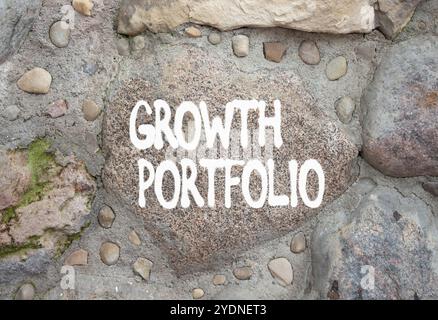 Growth Portfolio symbol. Stone wall with words Growth Portfolio. Beautiful stone background. Business and Growth Portfolio concept. Copy space. Stock Photo