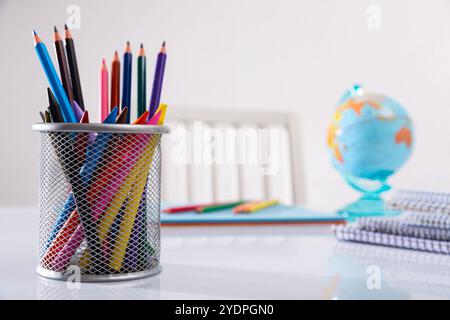 Concept of preparation for school. Different school supplies on the table Stock Photo