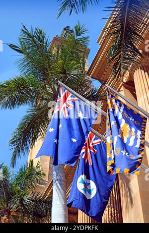 Brisbane, Australia - September 19, 2017: Flags Outside Brisbane's City Hall: Australian National Flag, Queensland State Flag & Brisbane City Flag. Stock Photo