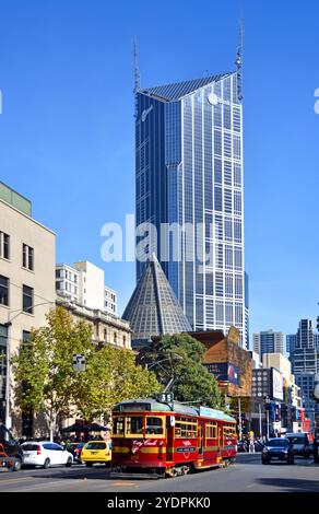 Melbourne, Australia - May 14, 2014: Vintage red tram in La Trobe street. In the background is the central tower and ME Bank Building Stock Photo